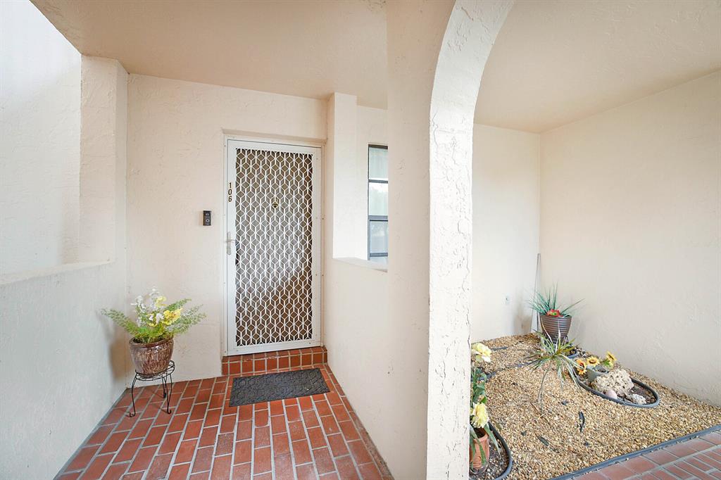 3485 Environ Boulevard, Unit C106 Lauderhill, FL 33319 - Photo 28 of 33 a view of a hallway to a livingroom with wooden floor
