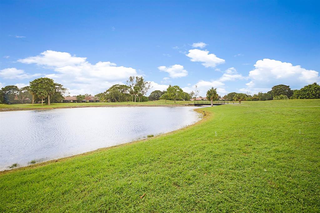3485 Environ Boulevard, Unit C106 Lauderhill, FL 33319 - Photo 5 of 33 a view of a lake with houses in the back