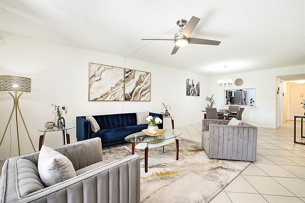 3485 Environ Boulevard, Unit C106 Lauderhill, FL 33319 - Photo 7 of 33 a living room with furniture and a couch
