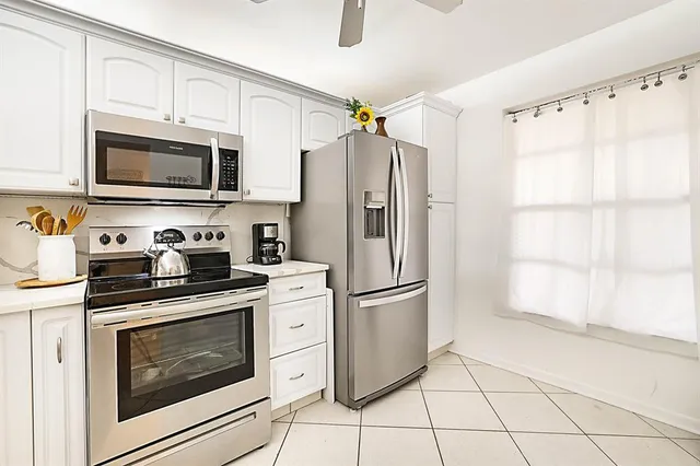 an aerial view of a house with a swimming pool