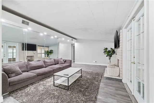 a living room with furniture and a rug