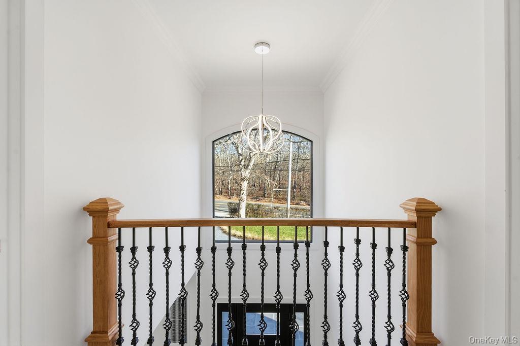 768 Bridgehampton Sag Harbor Bridgehampton, NY 11932 - Photo 21 of 35 Detailed view of crown molding and a chandelier