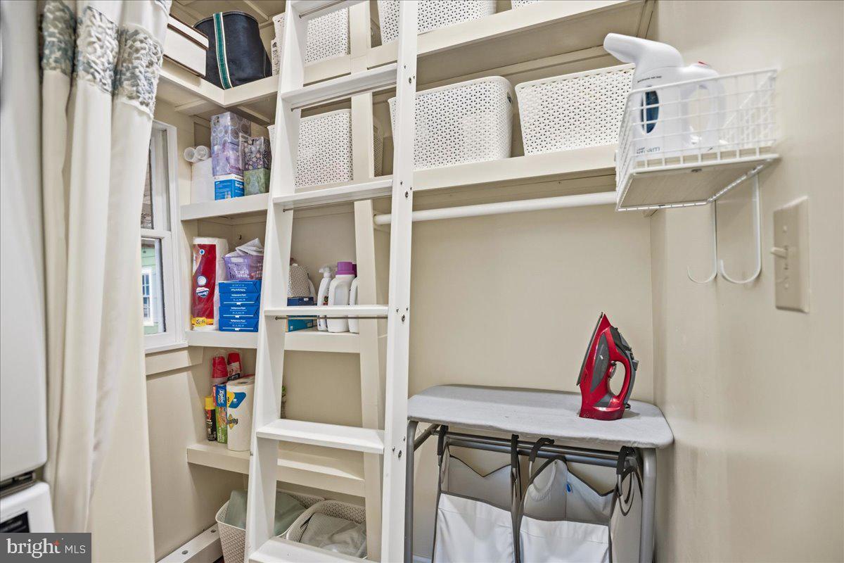 14382 Sedwick Avenue Solomons, MD 20688 - Photo 42 of 90 Smart storage with library ladder, ironing station