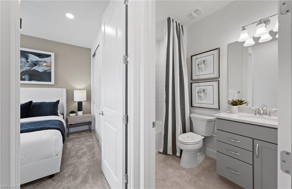 1879 Mesa Lane Naples, FL 34120 - Photo 12 of 24 a living room with furniture a fireplace and a mirror