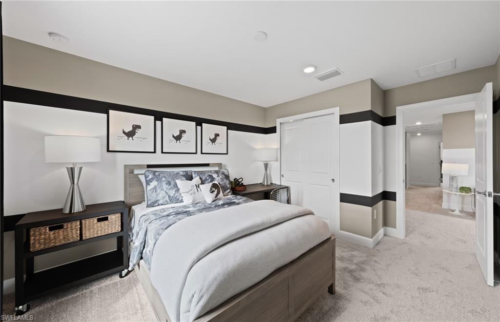 1879 Mesa Lane Naples, FL 34120 - Photo 16 of 24 a bedroom with a large bed and paintings on the wall