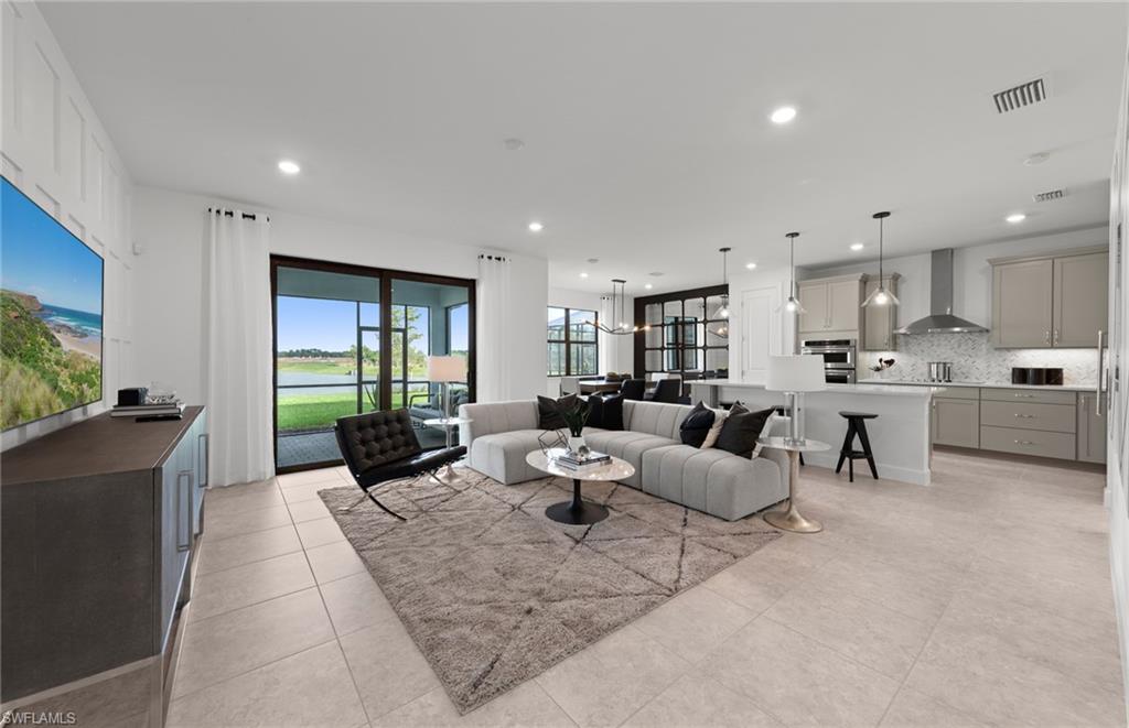 1879 Mesa Lane Naples, FL 34120 - Photo 7 of 24 a living room with furniture and a large window