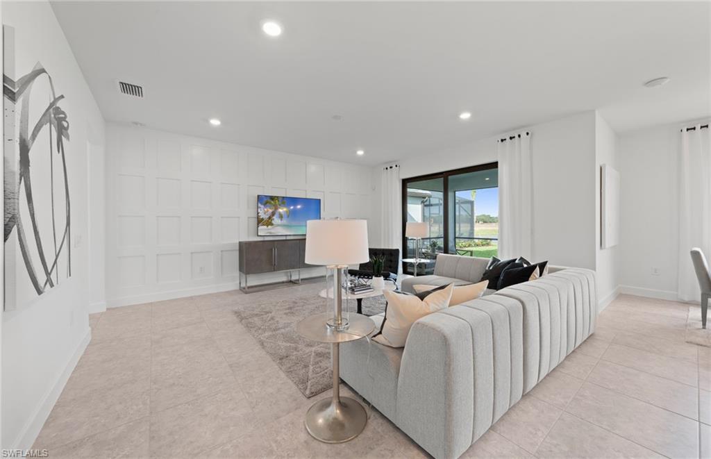 1879 Mesa Lane Naples, FL 34120 - Photo 8 of 24 a living room with furniture and a window