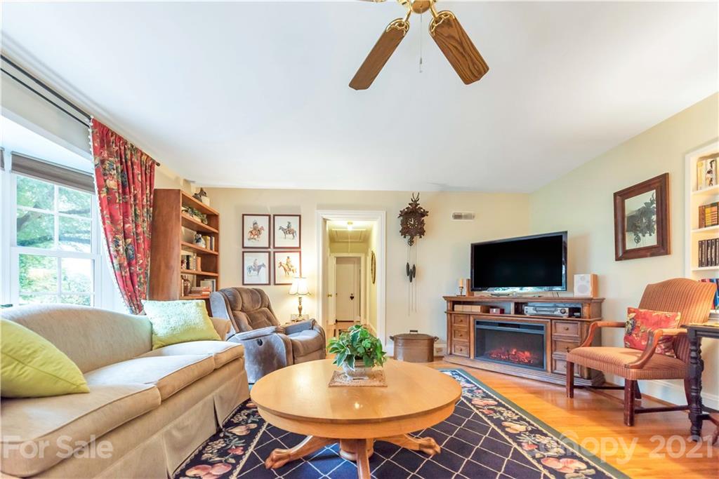 404 Dameron Road Bessemer City, NC 28016 - Photo 12 of 47 a living room with furniture a flat screen tv and a dining table