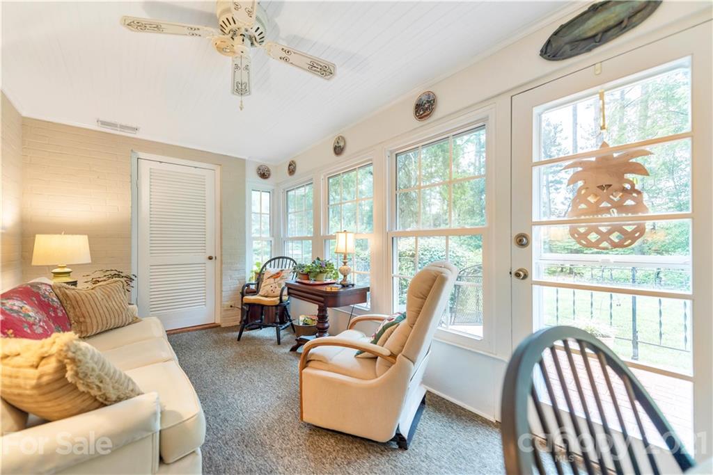 404 Dameron Road Bessemer City, NC 28016 - Photo 15 of 47 a living room with furniture and floor to ceiling windows