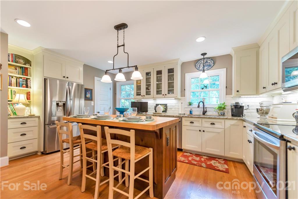 404 Dameron Road Bessemer City, NC 28016 - Photo 22 of 47 a kitchen with stainless steel appliances kitchen island granite countertop a stove a sink and a refrigerator