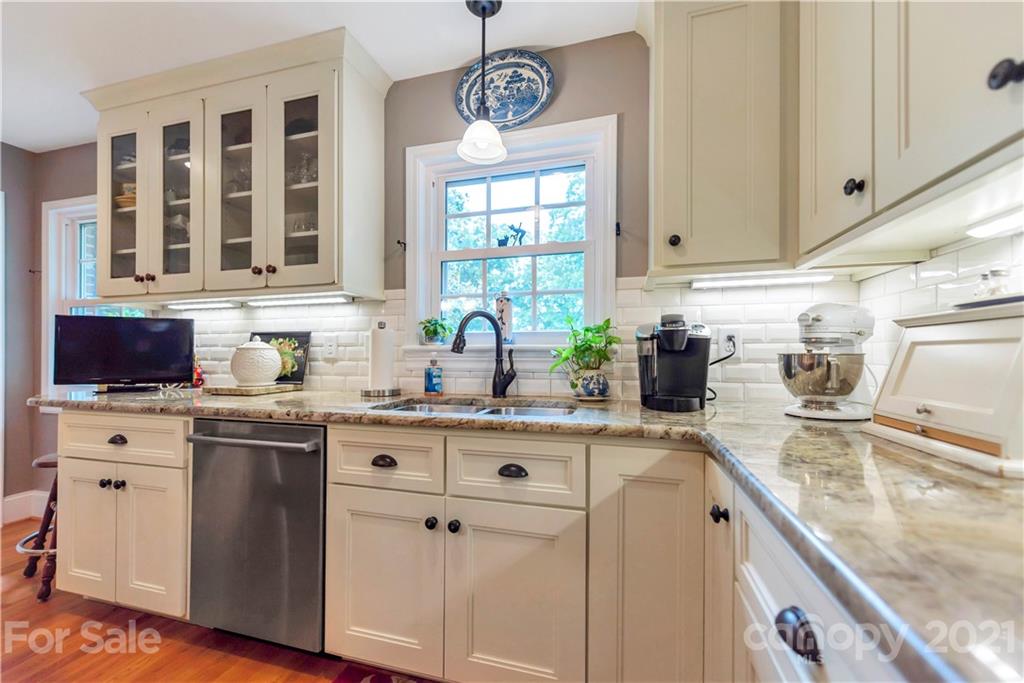 404 Dameron Road Bessemer City, NC 28016 - Photo 24 of 47 a kitchen with stainless steel appliances granite countertop a sink stove and cabinets