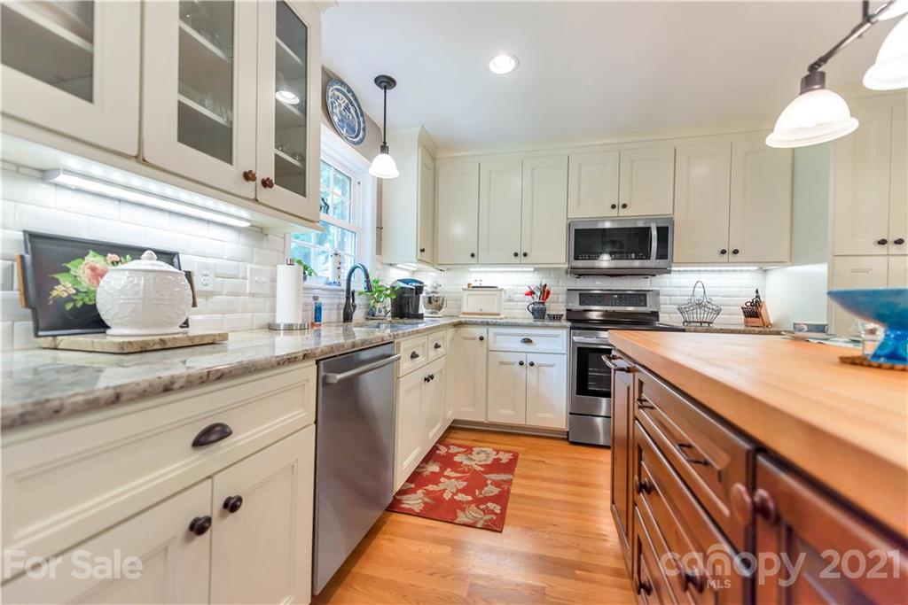 404 Dameron Road Bessemer City, NC 28016 - Photo 26 of 47 a kitchen with stainless steel appliances granite countertop a sink and cabinets