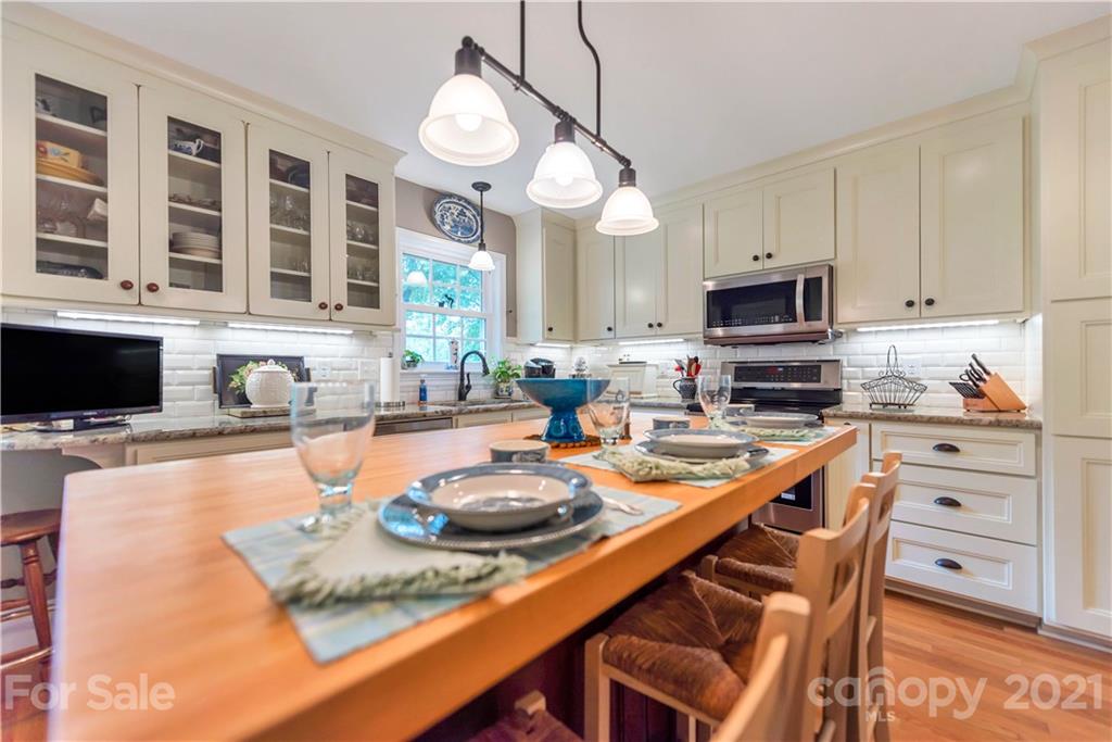 404 Dameron Road Bessemer City, NC 28016 - Photo 27 of 47 a kitchen with stainless steel appliances granite countertop a sink and cabinets