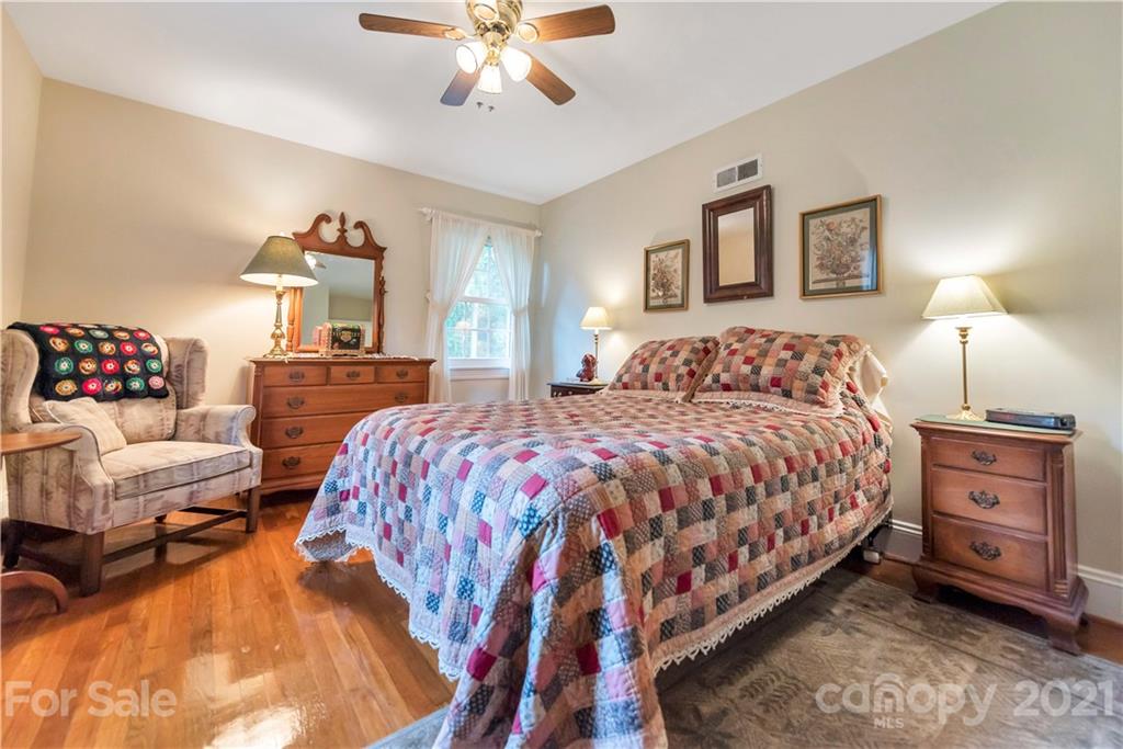 404 Dameron Road Bessemer City, NC 28016 - Photo 38 of 47 a bedroom with a bed and wooden floor