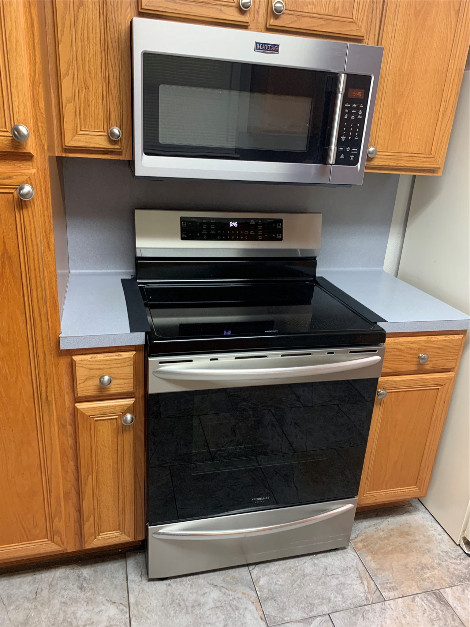 1110 East Rutgers Lane Deer Park, TX 77536 - Photo 7 of 19 Electric air fryer oven and microwave. Large pantry-like cabinets to left
