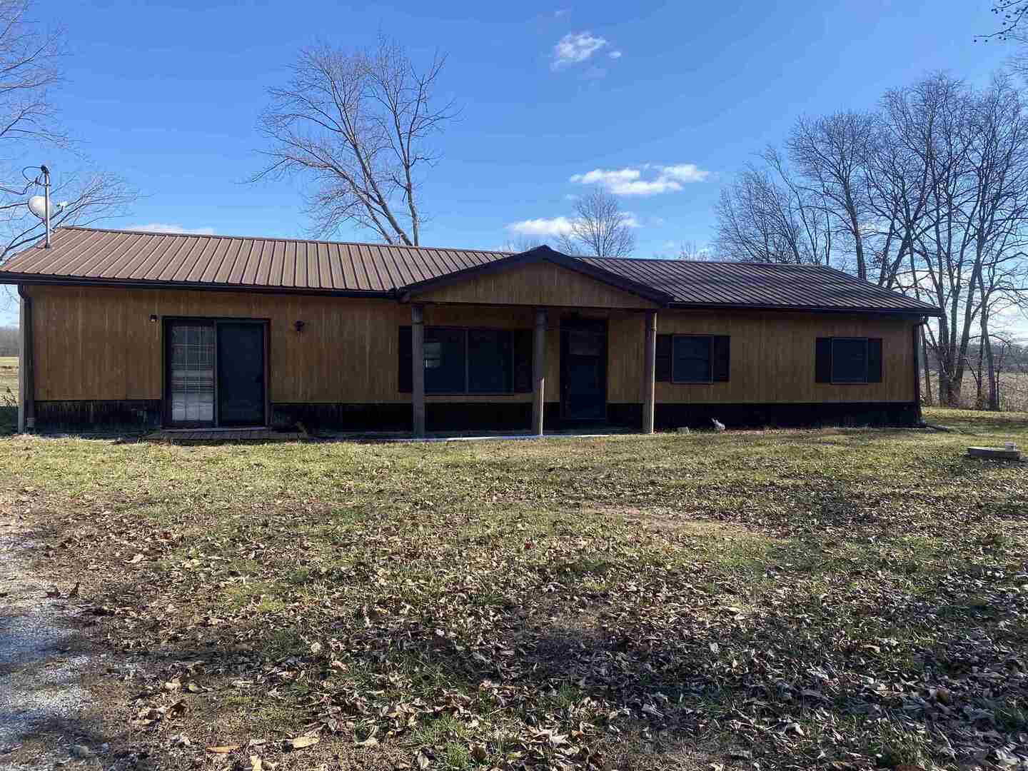 7038 Robin Road Du Bois, IL 62831 - Photo 1 of 29 a front view of a house with a garden