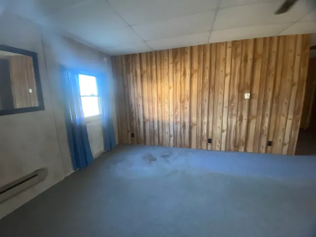 an empty room with windows and yard