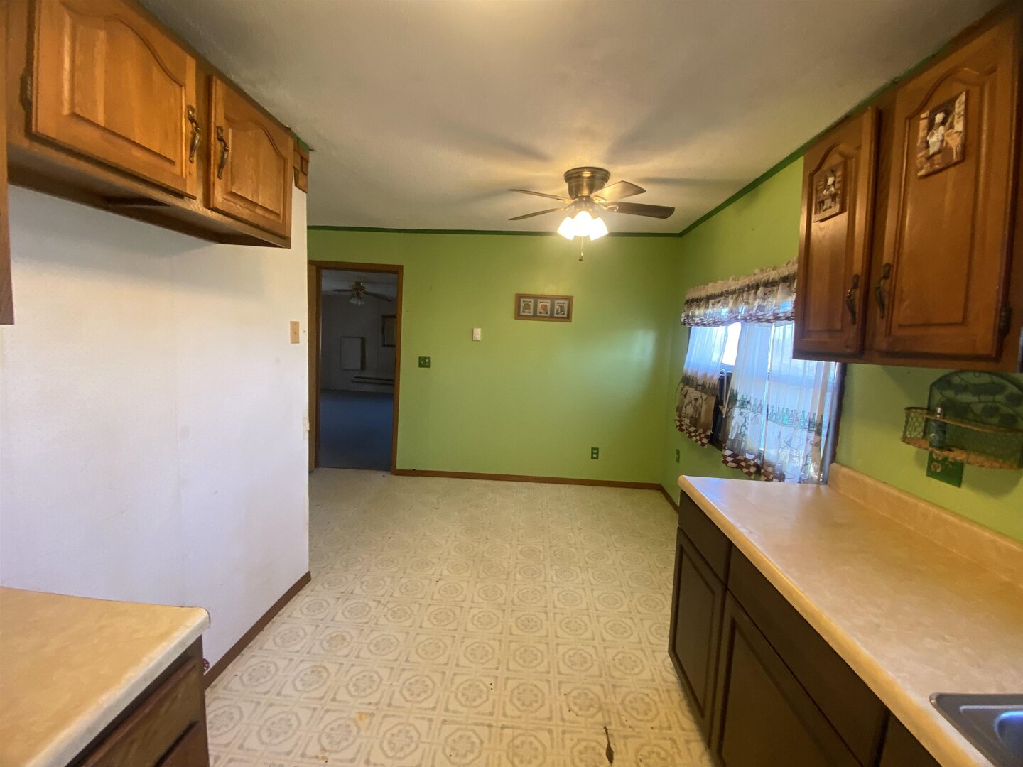 7038 Robin Road Du Bois, IL 62831 - Photo 20 of 29 a view of a kitchen with a sink and cabinets