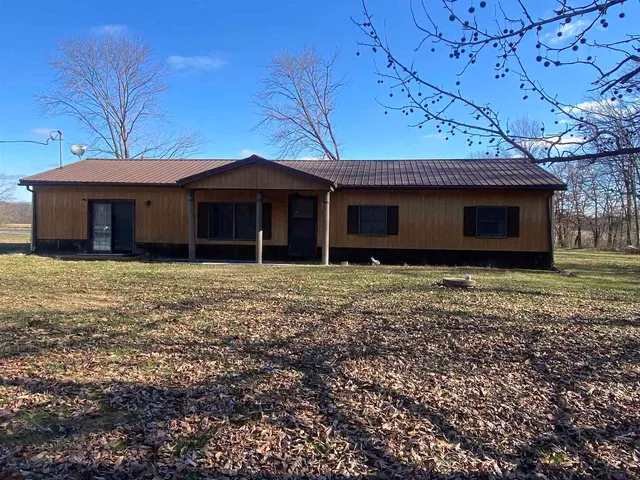 a view of a house with a garden