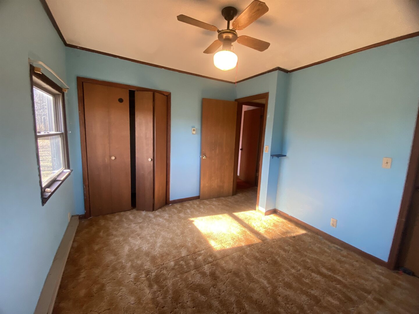 7038 Robin Road Du Bois, IL 62831 - Photo 6 of 29 a view of empty room with window and ceiling fan
