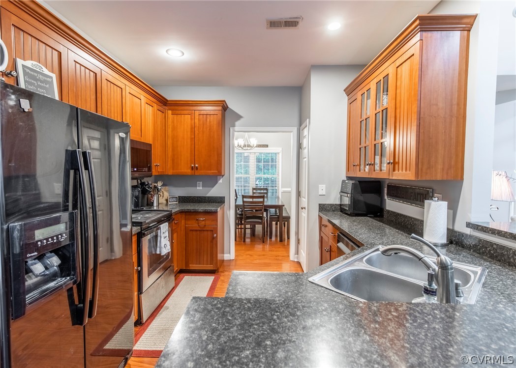 529 Brandywine Road Manquin, VA 23106 - Photo 14 of 50 a kitchen with large windows and refrigerator