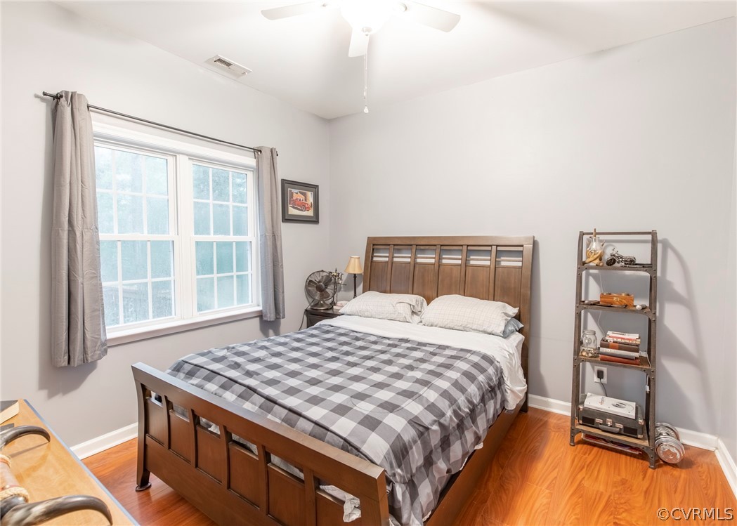 529 Brandywine Road Manquin, VA 23106 - Photo 20 of 50 a bedroom with a bed and a flat tv screen on the dresser