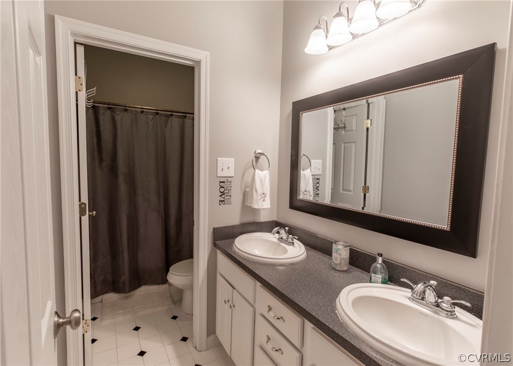 529 Brandywine Road Manquin, VA 23106 - Photo 22 of 50 a bathroom with a sink vanity granite and a mirror