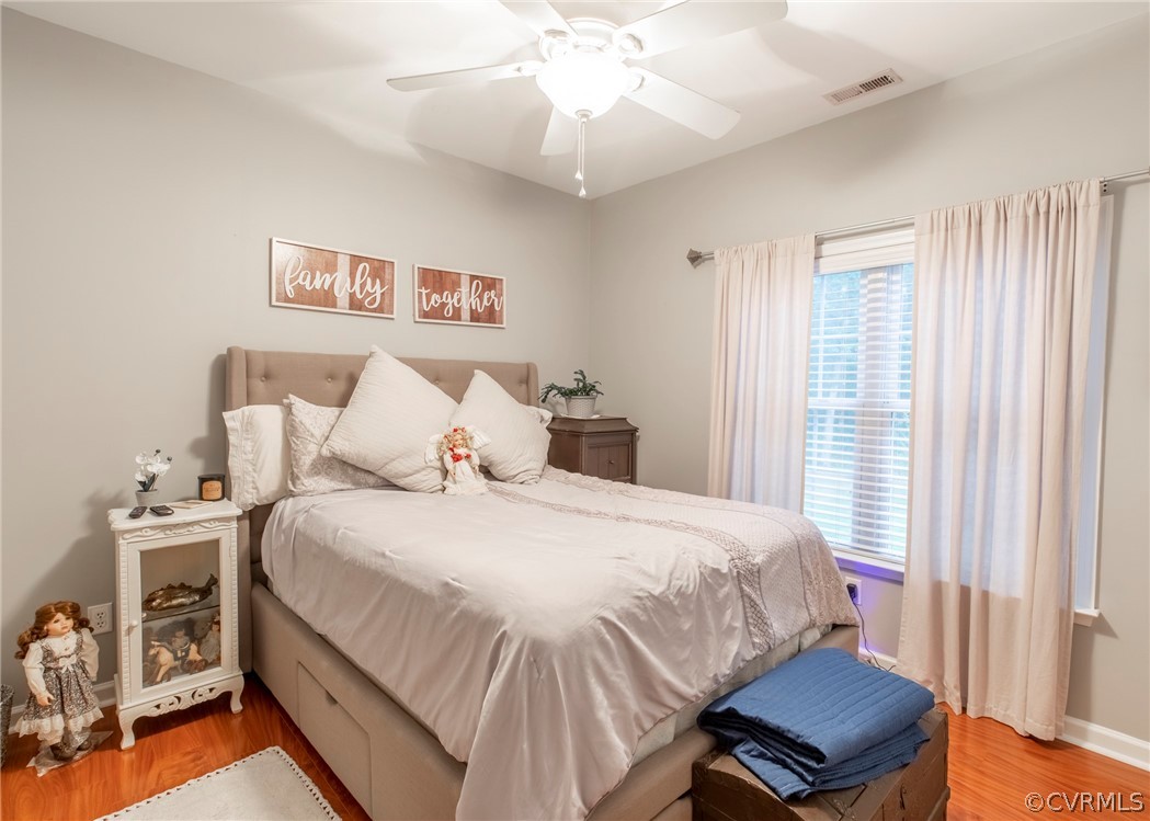 529 Brandywine Road Manquin, VA 23106 - Photo 24 of 50 a bedroom with a bed and a chandelier