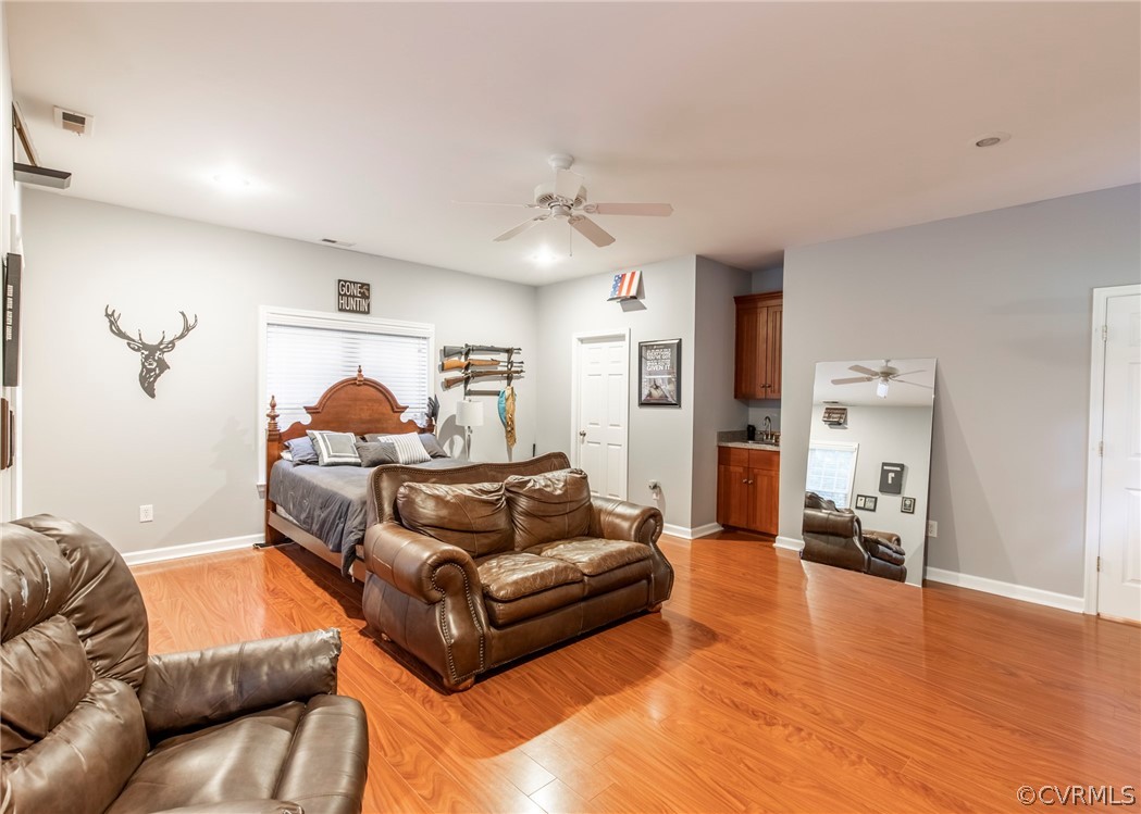 529 Brandywine Road Manquin, VA 23106 - Photo 26 of 50 a living room with furniture and a wooden floor