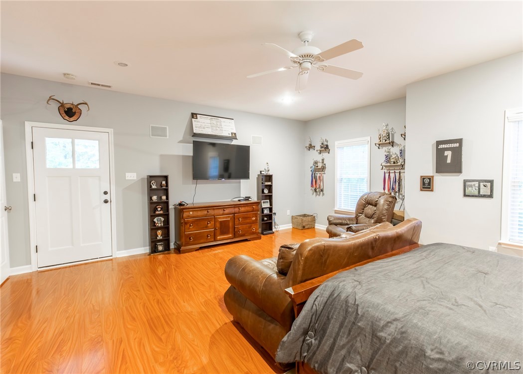 529 Brandywine Road Manquin, VA 23106 - Photo 28 of 50 a spacious bedroom with a bed and a flat screen tv
