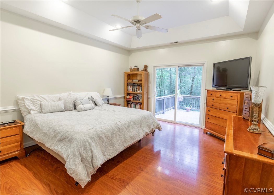 529 Brandywine Road Manquin, VA 23106 - Photo 30 of 50 a spacious bedroom with a bed and a flat screen tv