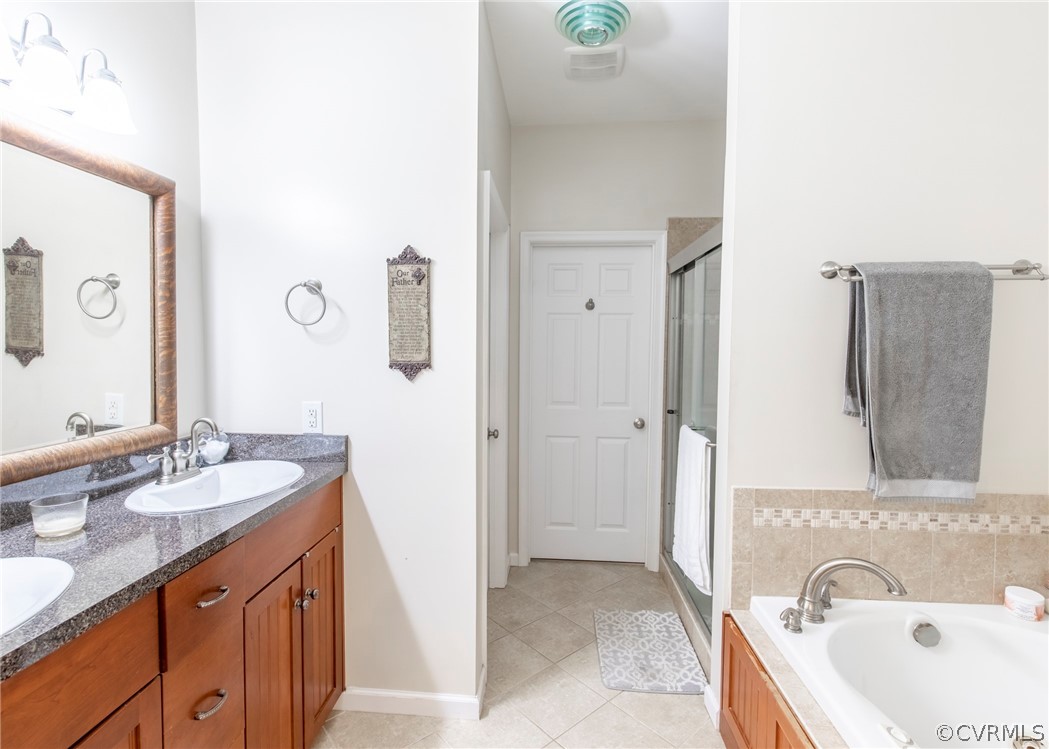 529 Brandywine Road Manquin, VA 23106 - Photo 32 of 50 a bathroom with a tub sink and mirror