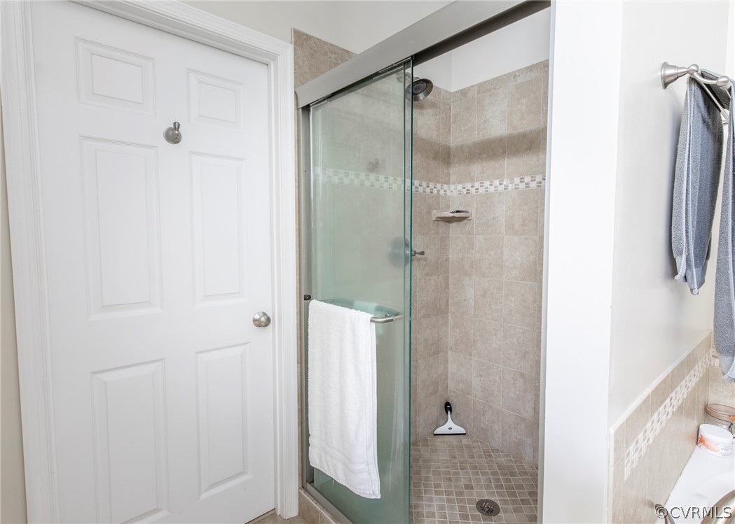 529 Brandywine Road Manquin, VA 23106 - Photo 36 of 50 a bathroom with a shower and a glass door