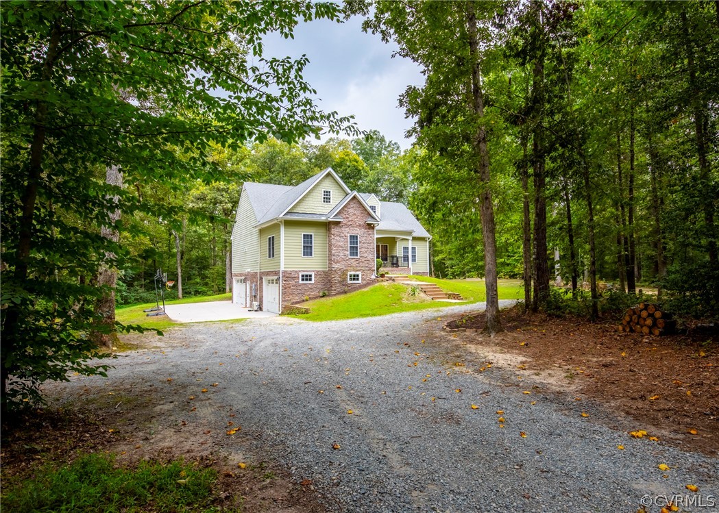 529 Brandywine Road Manquin, VA 23106 - Photo 46 of 50 a view of a house with a yard and swimming pool