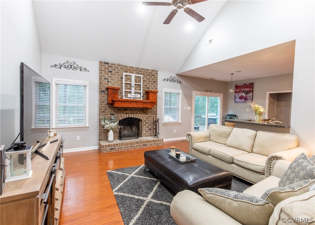 529 Brandywine Road Manquin, VA 23106 - Photo 9 of 50 a living room with furniture a large window and a fireplace