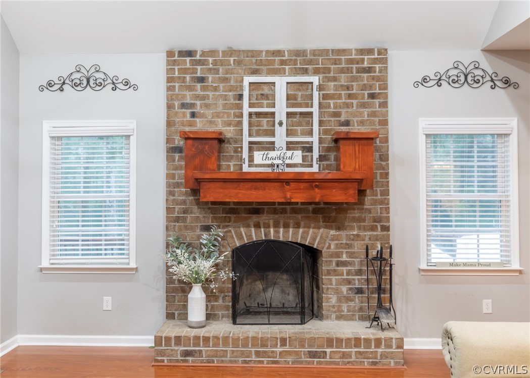 529 Brandywine Road Manquin, VA 23106 - Photo 10 of 50 a living room with a fireplace and windows