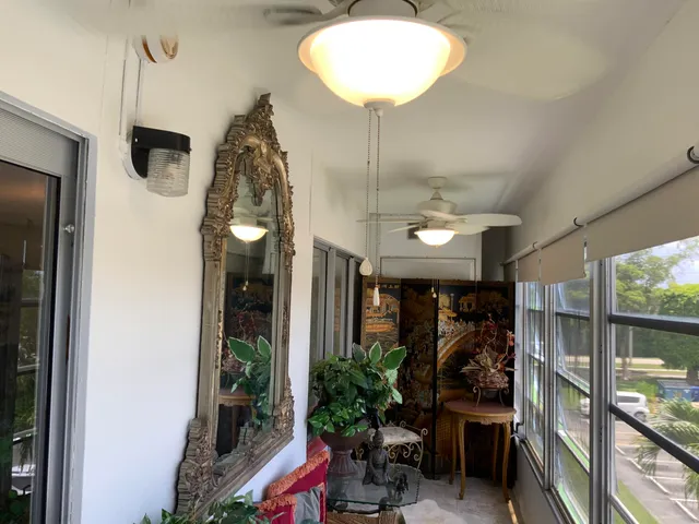a living room filled with furniture and flowers