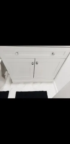 a living room with furniture and potted plant