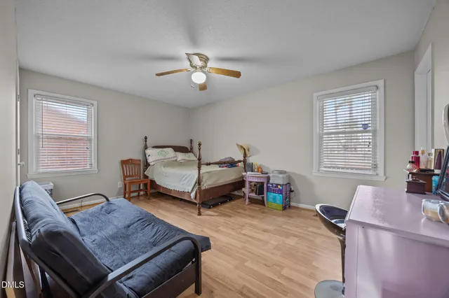 a bedroom with furniture and a window