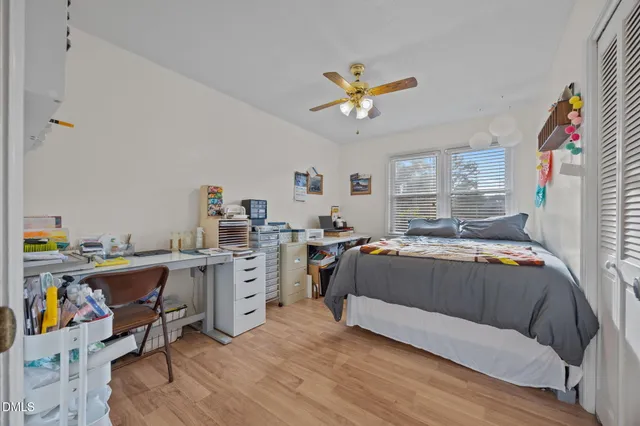 a living room with a couch and dresser