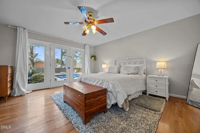 a spacious bedroom with a bed and a large window