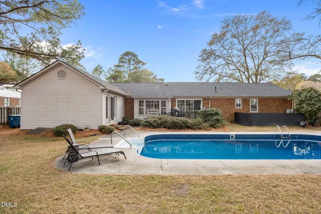 a front view of house with yard and outdoor seating