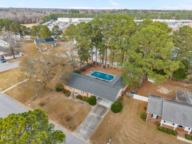 an aerial view of residential houses with outdoor space