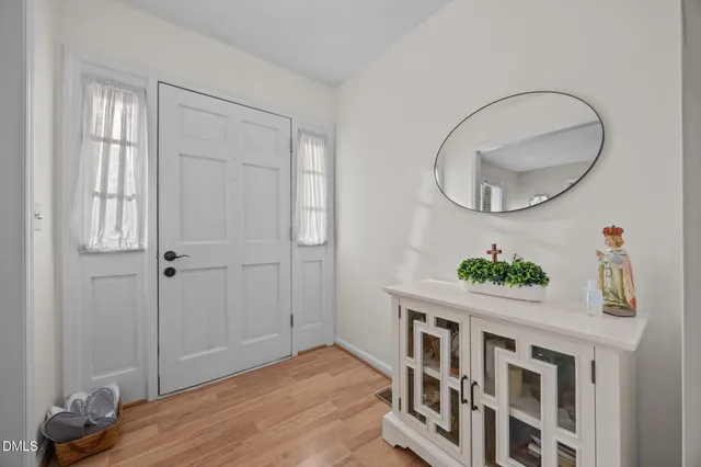 a view of an entryway with wooden floor
