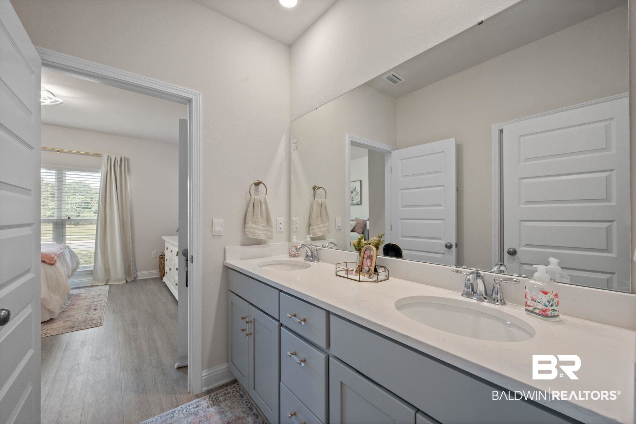 681 Calibre Street Fairhope, AL 36532 - Photo 9 of 56 Bathroom featuring vanity and wood-type flooring