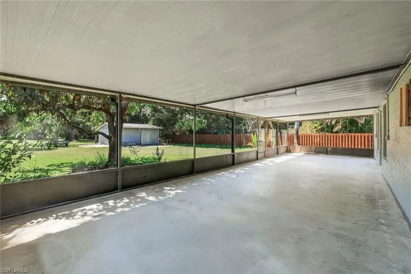 a view of a porch with wooden floor