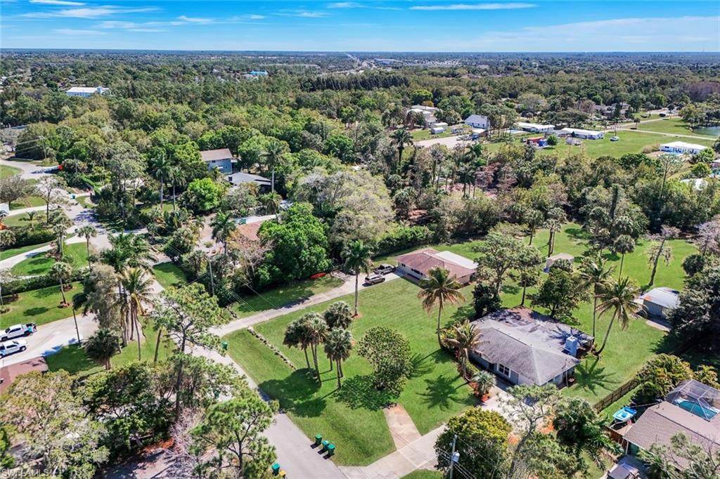 5290 Cypress Lane Naples, FL 34113 - Photo 30 of 35 an aerial view of a city with lots of residential buildings