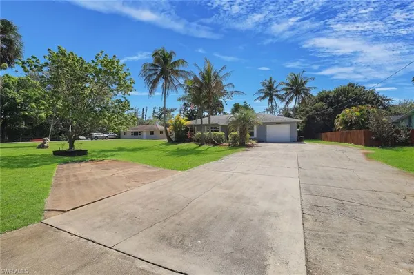 a road view with a garden