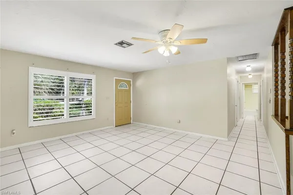 a view of an empty room and window