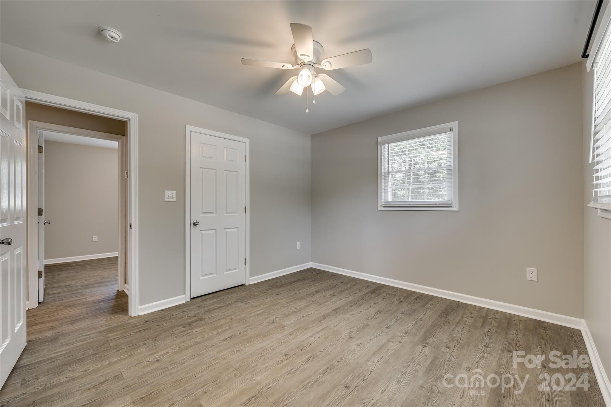 493 South Beersheba Road Clover, SC 29710 - Photo 19 of 25 an empty room with wooden floor and ceiling fan